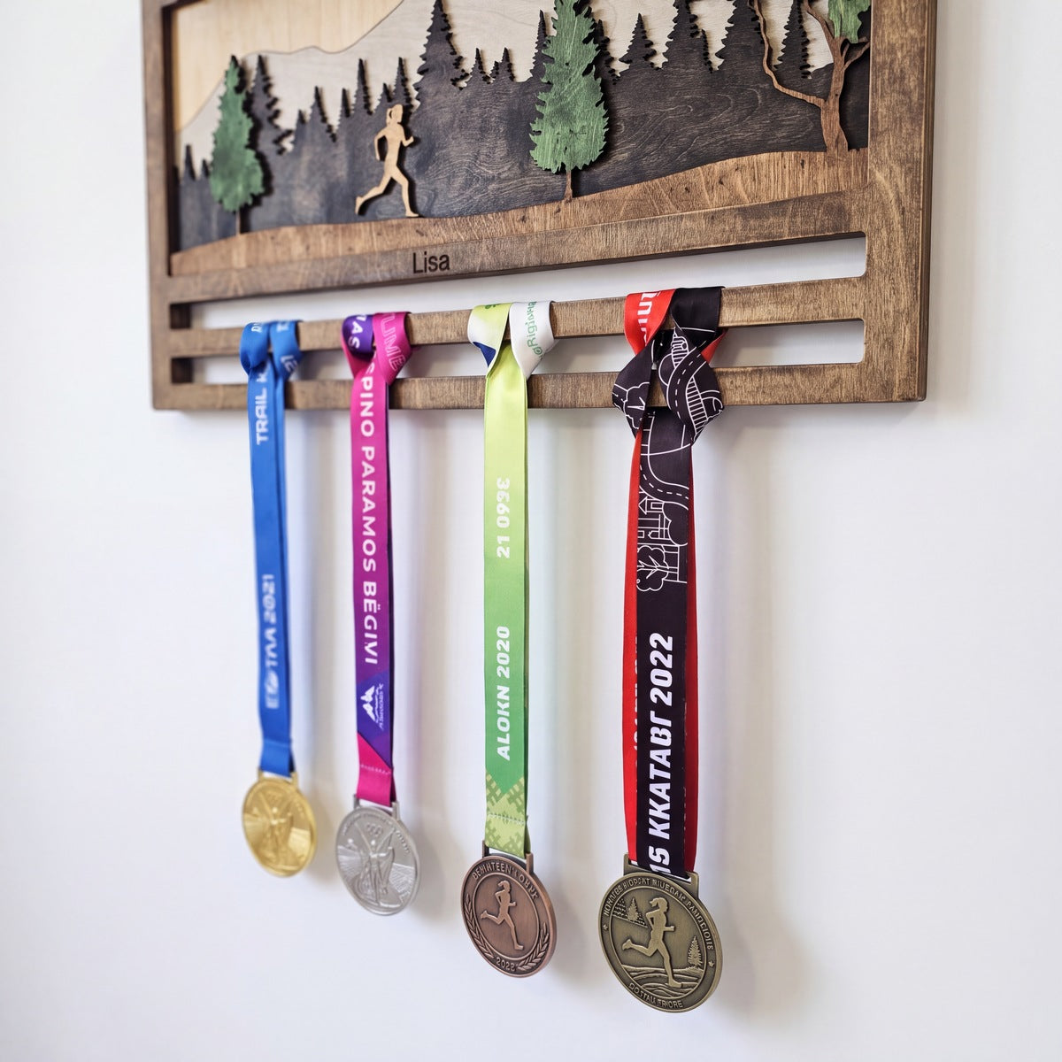 Running Medal Display — in a runner's home on the wall | Story of Miles