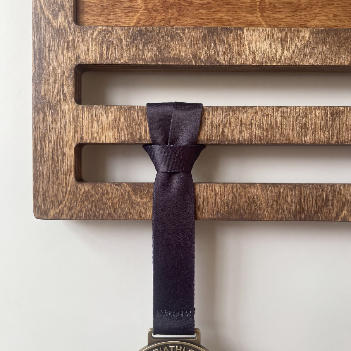 Triathlon Medal Display — medals hanging on the personalised display | Story of Miles