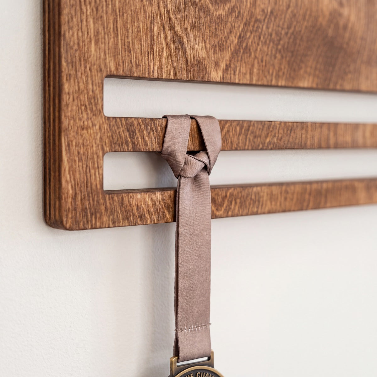 Medal Display with Personal — medals hanging on the personalised display | Story of Miles