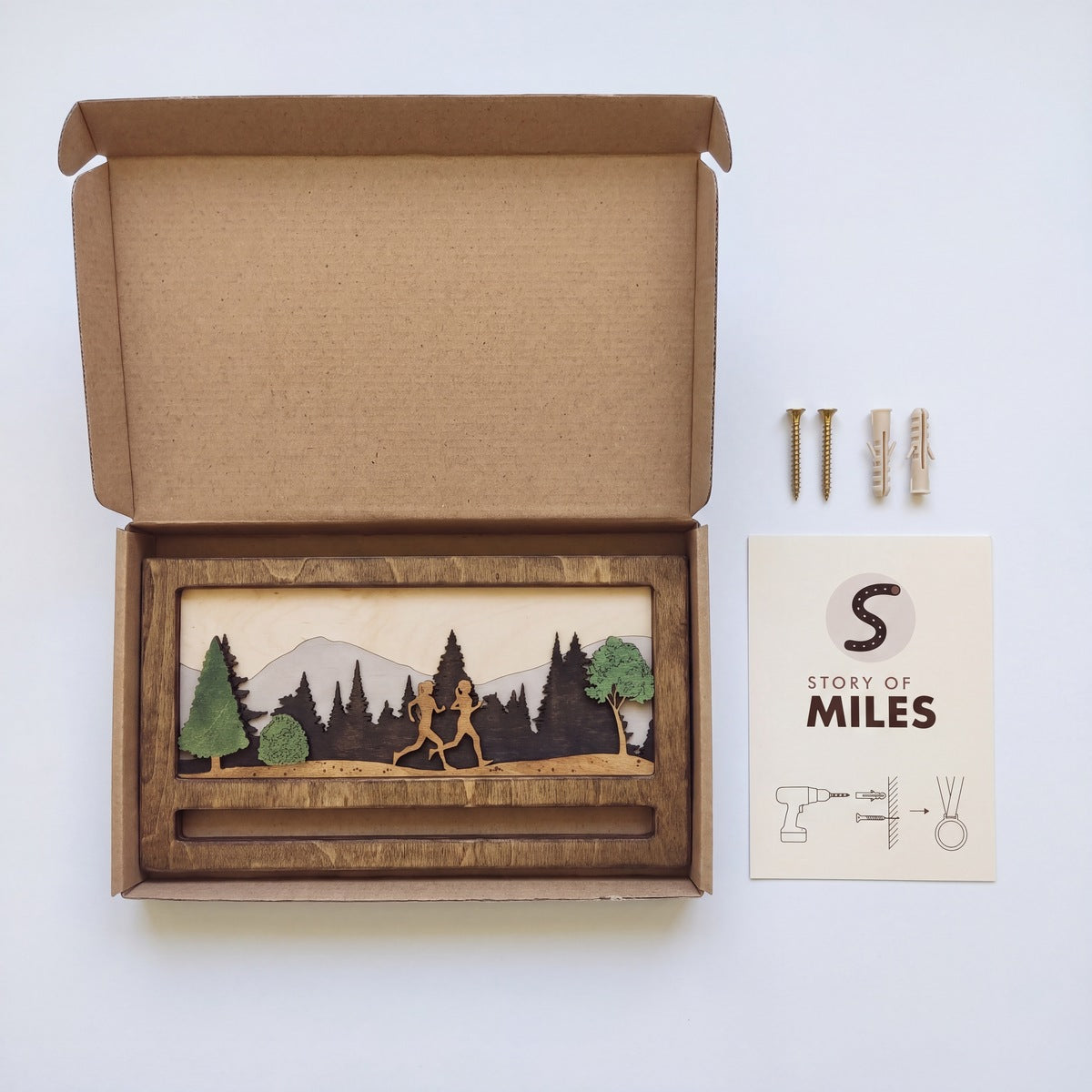 Mini Medal Display — close-up of the engraved wooden detail | Story of Miles